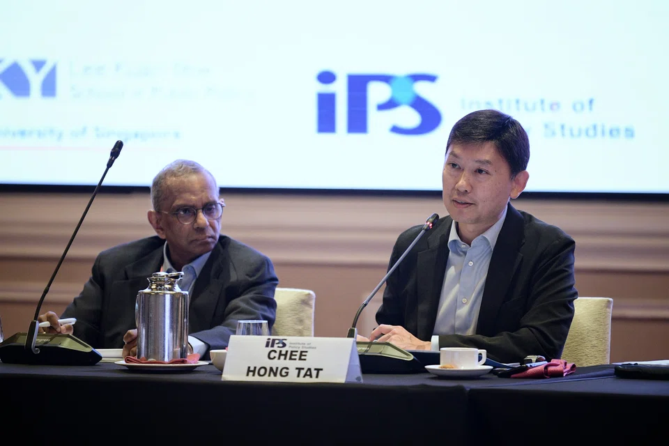 Senior Minister of State for Finance and Transport Chee Hong Tat (right) speaks during a panel discussion at the 37th Singapore Economic Roundtable moderated by Manu Bhaskaran, adjunct senior research fellow at the Institute of Policy Studies.