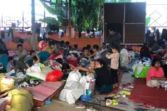 People resting at a shelter in Lashio, Shan state. The rebel offensive initially made inroads in junta-controlled areas on the border with China in Shan State, where military authorities have lost control of several towns and more than 100 security outposts.