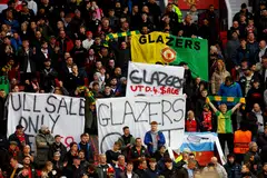 Manchester United fans display banners in protest of the Glazer family’s ownership of the club, Old Trafford, Manchester, April 13, 2023.