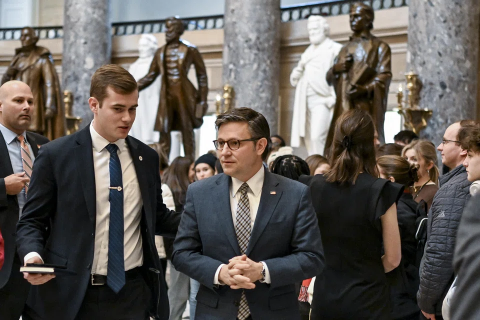 US House Speaker Mike Johnson (centre) at the Capitol in Washington, Jan 18, 2024. Despite the urgency, dozens of conservatives in the House voted against the stop-gap measure but Democrats provided Republican Speaker Johnson enough backing to smooth its passage.