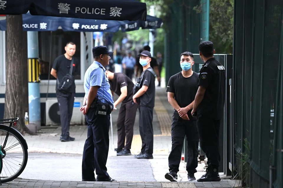 Police and security personnel stand outside the entrance of the Japanese embassy in Beijing on Aug 26, 2023. Security has been increased at the embassy since the release of waste water at the Fukushima nuclear plant in Japan on Aug 24. 