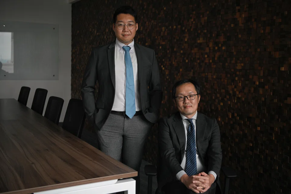 Masahiro Nishii (right), managing director of Nihon M&A Center Singapore, and Daniel Lee, senior consultant at the firm. Nihon M&A Center Singapore has closed 11 deals so far.