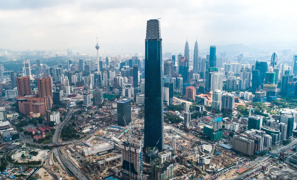 Malaysia's Exchange 106 tower, tallest in Malaysia at 492m, located in the upcoming financial district in Kuala Lumpur called Tun Razak Exchange. The Petronas Twin Towers, once the world's tallest buildings, can be seen in the background.