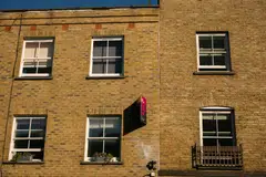 Some property owners are converting flats into short-term rental units marketed through platforms including Airbnb as a way of boosting income. 