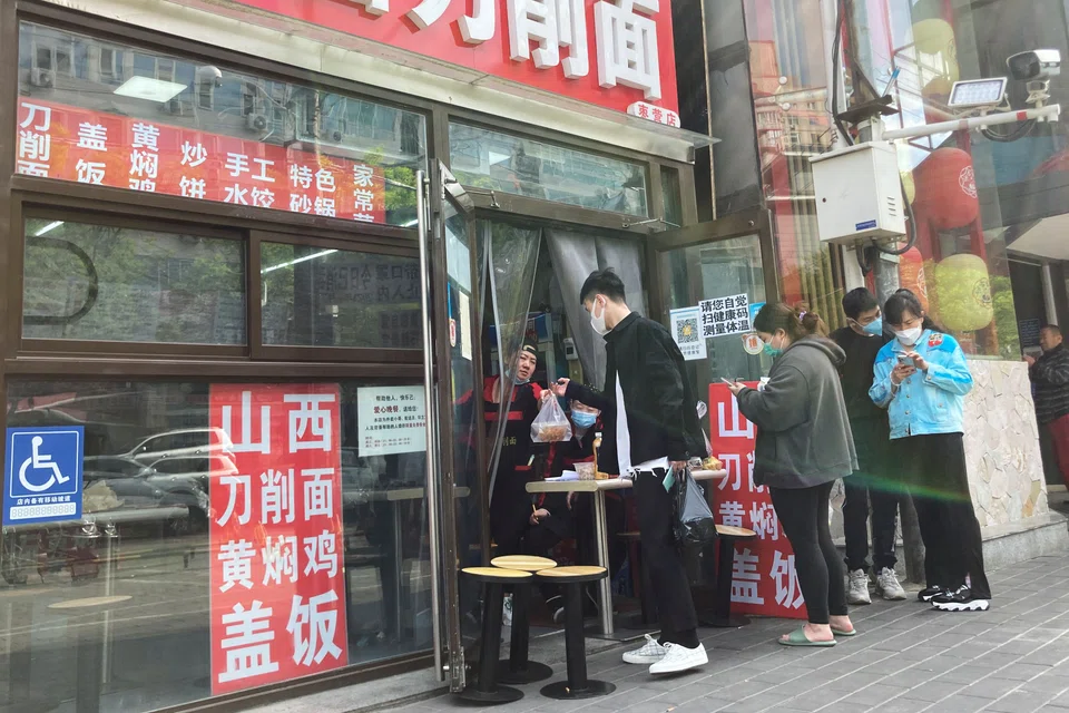 Beijing tightened Covid restrictions on Sunday (May 1) as it battled an outbreak, while Shanghai let some of its 25 million residents venture out for light and air after reporting a second day of zero infections.