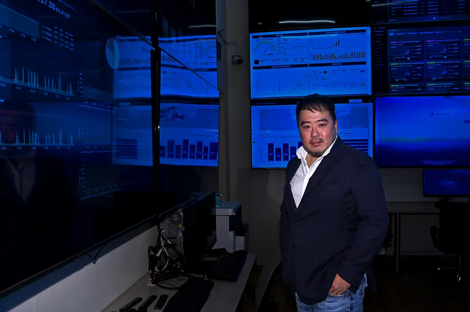 EDPR Sunseap's business chief executive officer Frank Phuan in its monitoring room. The company, which won an Emerging Enterprise Award in 2014 as a solar lessor, now has a comprehensive range of green products and services. 