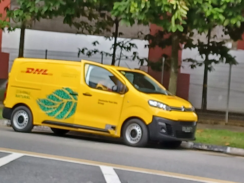 DHL Express Singapore's electric vans. Logistics firms are seeing more applications from former gig economy drivers.