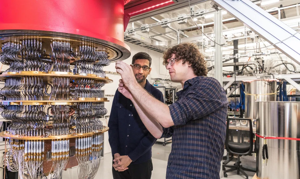 Google CEO Sundar Pichai (left), and a Google researcher with Google's quantum computer, a supercomputer, in October 2019.   