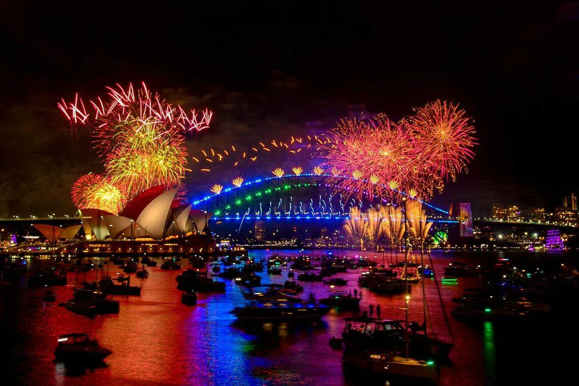 Ringing in the new year with fireworks over the Sydney Harbour Bridge and Sydney Opera House. Much of the world’s population – now more than eight billion – is hoping to shake off high living costs and global tumult in 2024.