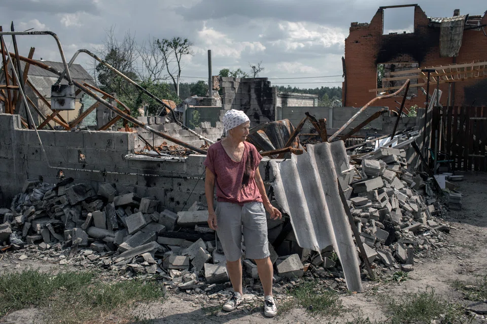 Valentyna Chernenko, 74, surveys the wreckage of her home, destroyed in shelling in mid-March, in the village of Moschun, near Kyiv, Ukraine, on Tuesday, July 5, 2022. 