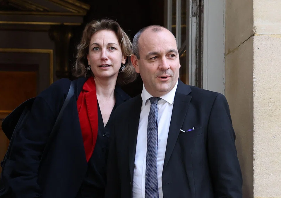 CFDT union's general secretary Laurent Berger (R) and deputy general secretary, Marylise Leon (L), arrive for a meeting with French Prime Minister as part of talks with unions representatives about government plans to raise the retirement age in France.