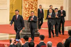 China's President Xi Jinping with members of the new Politburo Standing Committee - Li Qiang, Zhao Leji, Wang Huning, Cai Qi, Ding Xuexiang and Li Xi.