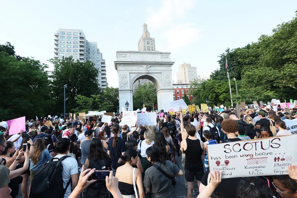 People gather to protest the US Supreme Court's decision to overturn the landmark 1973 ruling that recognised a woman’s constitutional right to an abortion.