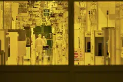 Cleanroom technicians at a Globalfoundries semiconductor fabrication facility in Singapore. HSBC economist Yun Liu said demand for chips “appears to be holding up” even with a decline in consumer electronics.