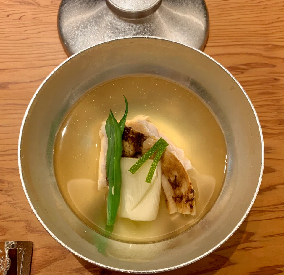 Clear dashi with amadei, matsutake mushroom and leek.