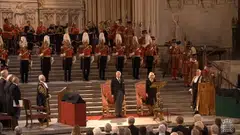 A grab from a handout video made available by the UK Parliamentary Recording Unit shows Britain's King Charles III (at centre left) and Camilla the Queen Consort and speaker of the House of Commons Lindsay Hoyle (right) singing the national anthem following his address to the Houses of Parliament at Westminster Hall in London. 