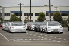 Cars lined up outside the Tesla car manufacturing plant in California. The US purchasing managers' index has stayed below the 50 threshold for eight straight months indicating a contraction in manufacturing. 