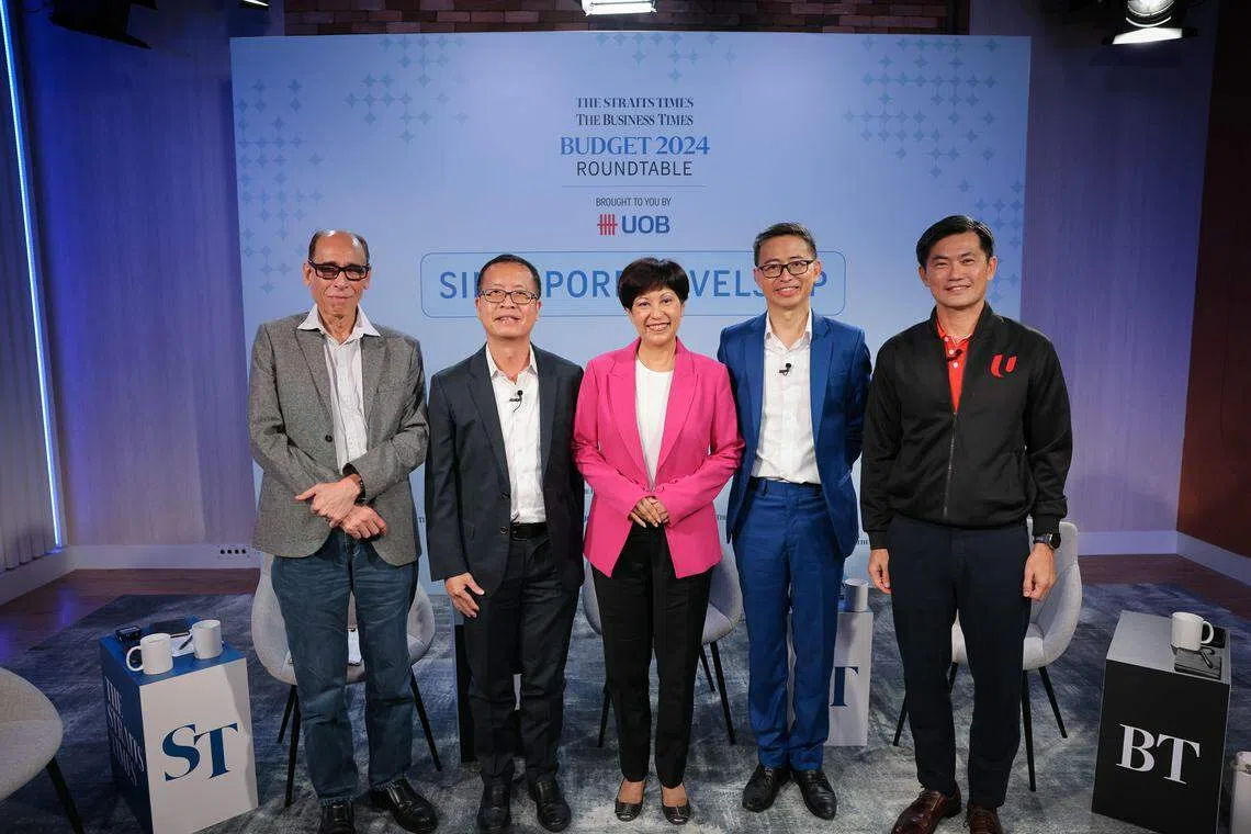 The ST-BT Budget Roundtable 2024 was moderated by ST associate editor Vikram Khanna (left), with panellists (L to R) UOB senior economist Alvin Liew; Second Minister for Finance Indranee Rajah; Association of Small and Medium Enterprises president Ang Yuit; and NTUC deputy secretary-general Desmond Tan. 