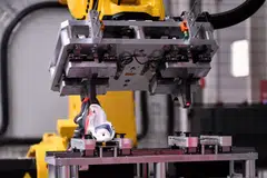 A machine tearing off the rubber sole of a shoe. Previously, recyclers had to bake the shoes for many hours to melt the glue and then pull the sole off by hand.