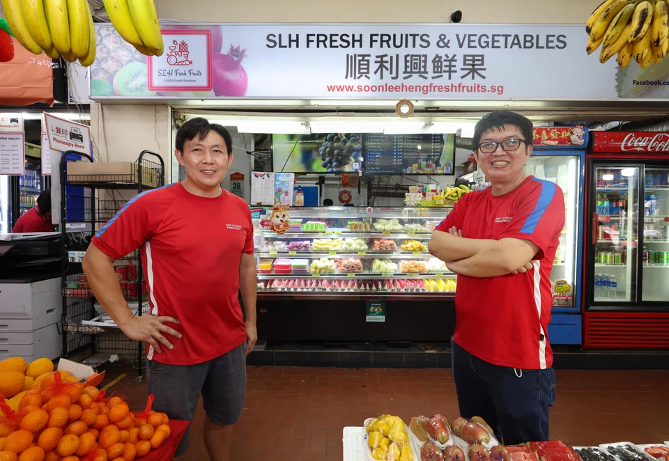 Brothers Ang Eng Guan (left) and Ang Eng Hwa set up fruits stall Soon Lee Heng (SLH) Fresh Fruits Trading in 2014.  