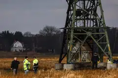 Police investigators inspect a damaged high-voltage pylon near the Tesla Gigafactory in Gruenheide. Local media published a letter purportedly from a far-left activist organisation called the Volcano Group that claimed responsibility for the incident, in a 2,500-word attack on Tesla and its billionaire CEO Musk.