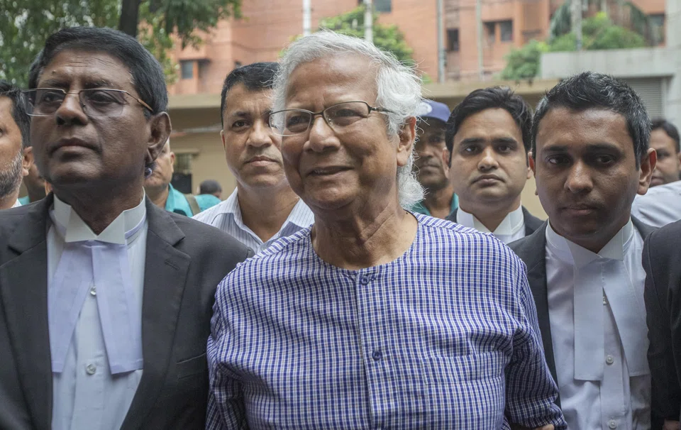Muhammad Yunus (centre) arriving at the Anti-Corruption Commission office in Dhaka on Thursday (Oct 5), to face money-laundering and embezzlement charges. He is denying guilt. 