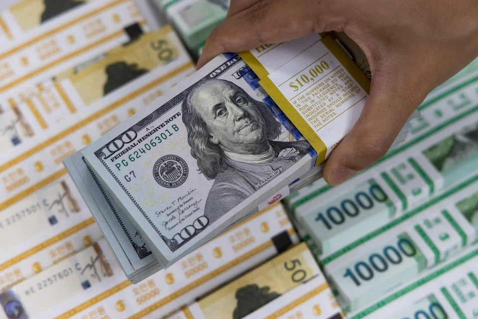 The dollar mostly held a slight gain following US data showing consumer sentiment improved moderately in September.