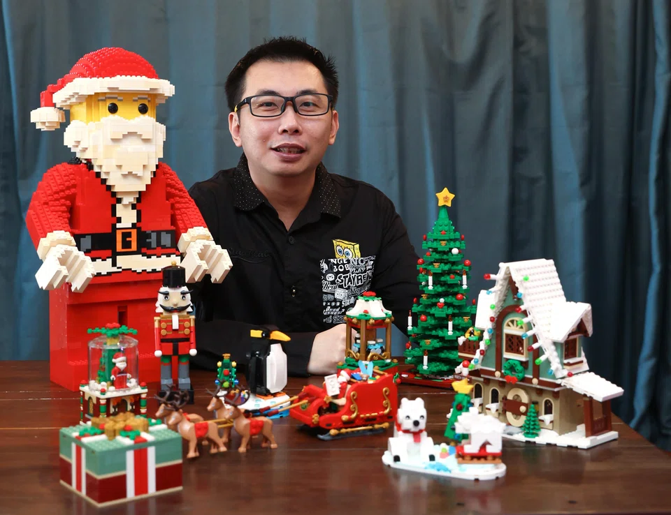 Lego collector Chun Guan Neo with his Christmas figures.