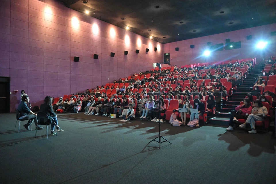 Director Jung Yoon-suk (left) answering questions  after a screening of Dear Jinri at the Busan International Film Festival; audible sobs from the audience could be heard throughout the screening.