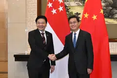 Singapore's Deputy Prime Minister Lawrence Wong (left) with Chinese Finance Minister Lan Fo'an at the Diaoyutai State Guesthouse in Beijing on Dec 8. It was the first time that both were meeting in their capacities as finance ministers.