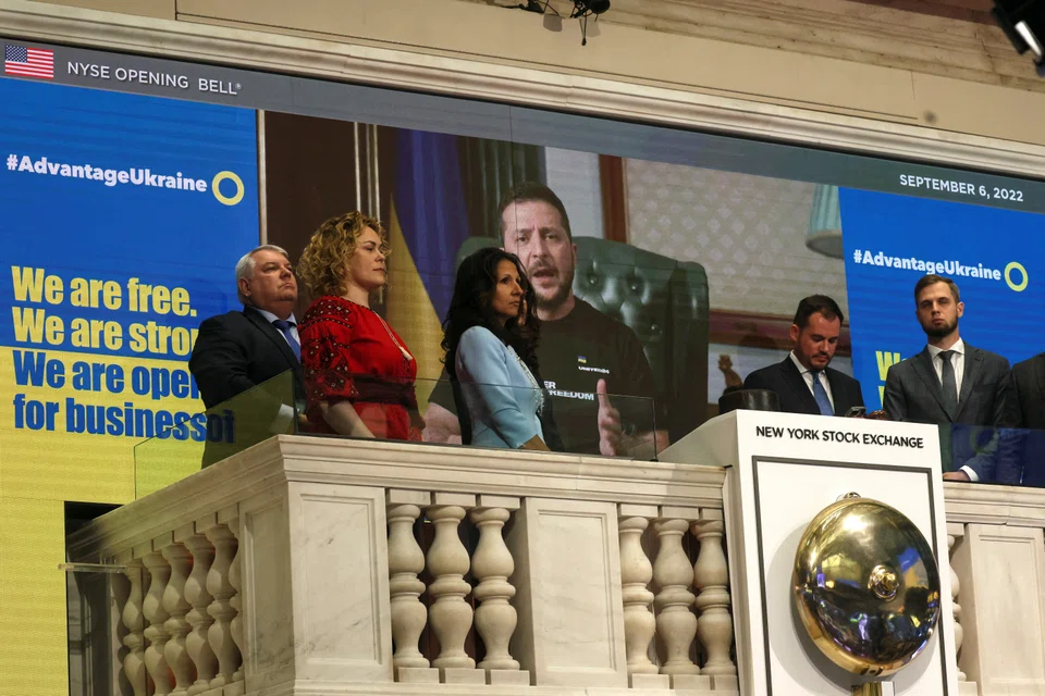 Zelenskiy appeared on a video screen behind the platform overlooking the NYSE floor where the opening bell is traditionally rung. Traders applauded and whooped while a banner read: “We are free. We are strong. We are open for business.”