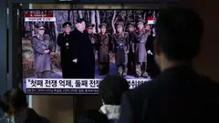 People watch a news broadcast at a train station in Seoul, South Korea, March 10, 2023. A submarine fired the weapons from waters off the eastern coastal city of Sinpo on Sunday morning, the KCNA news agency said. 