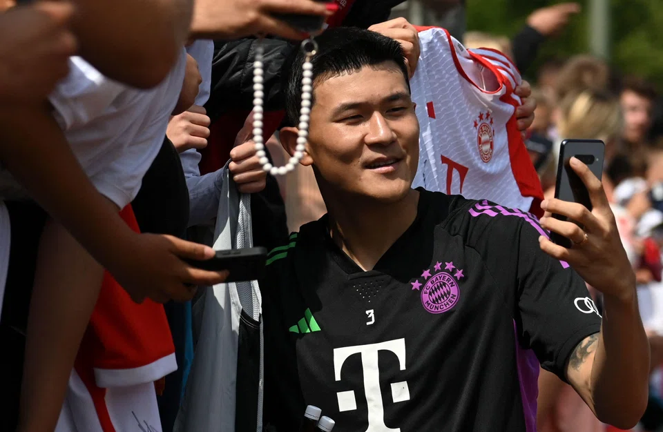 Bayern Munich's new signing Kim Min-jae takes a selfie with fans after a training session in Germany. The South Korean defender could be in Singapore to face Liverpool on Aug 2.