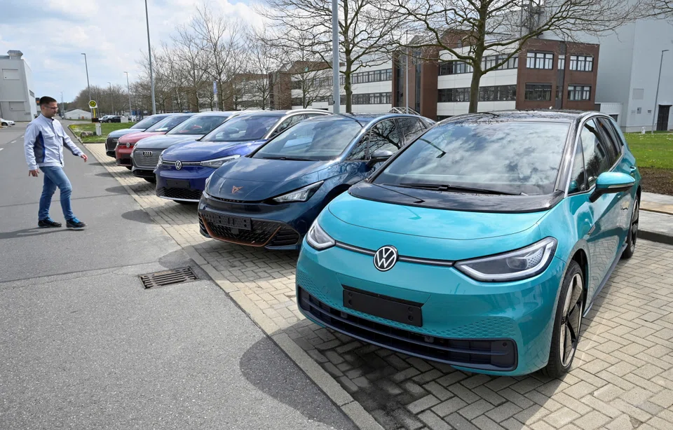 Electric car models parked outside a Volkswagen Group production plant in Zwickau, Germany, April  2022. Volkswagen plans to construct six gigafactories by 2030.