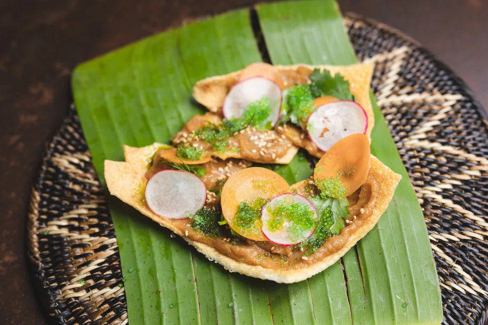 Cassava chips topped with eggplant and pickled carrot.