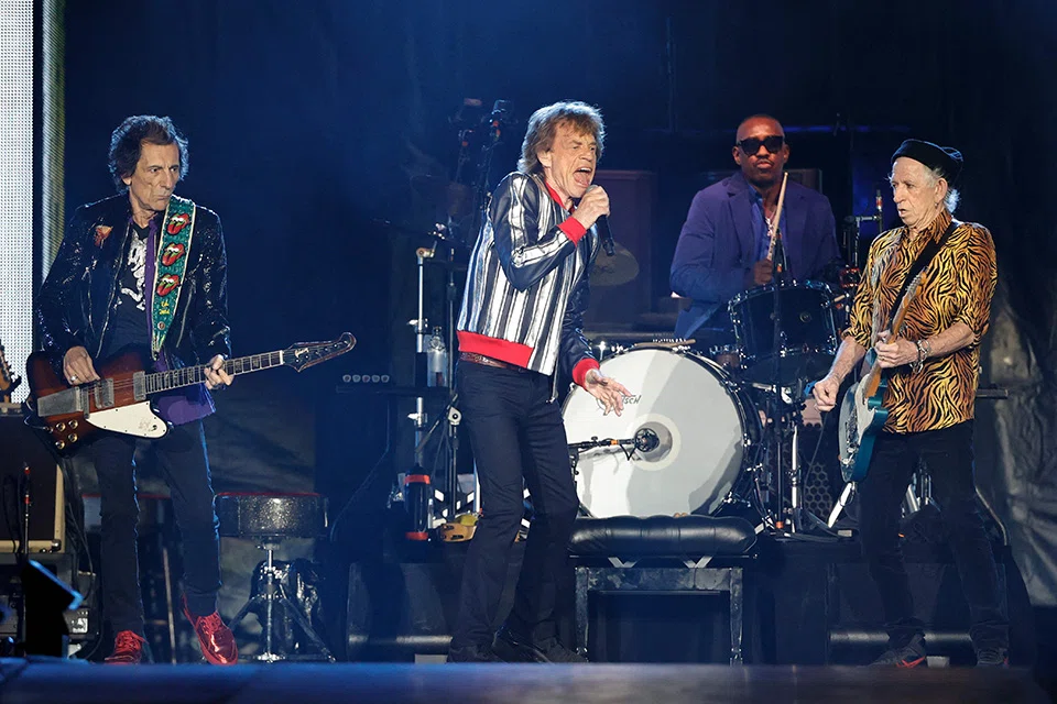 (FILES) In this file photo taken on September 27, 2021 British singer Mick Jagger (C), US drummer Steve Jordan (back), guitar players Keith Richards (R) and Ronnie Wood (L) perform during the Rolling Stones "No Filter" 2021 North American tour at The Dome at America's Center stadium in St. Louis, Missouri. 