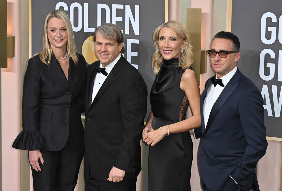 Katie Boehly, US businessman Todd Boehly, Helen Hoehne, and a guest arrive for the 80th annual Golden Globe Awards at The Beverly Hilton hotel in Beverly Hills, California, on Jan 10, 2023. The scandal-hit association of foreign journalists that created the Golden Globes will be wound down as the Hollywood award show is formally purchased by private investors including US billionaire Todd Boehly.