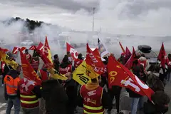 Strikers blocking a motorway on Thursday; polls show that a majority of voters oppose President Emmanuel Macron’s plan to delay the state pension age by two years to 64.