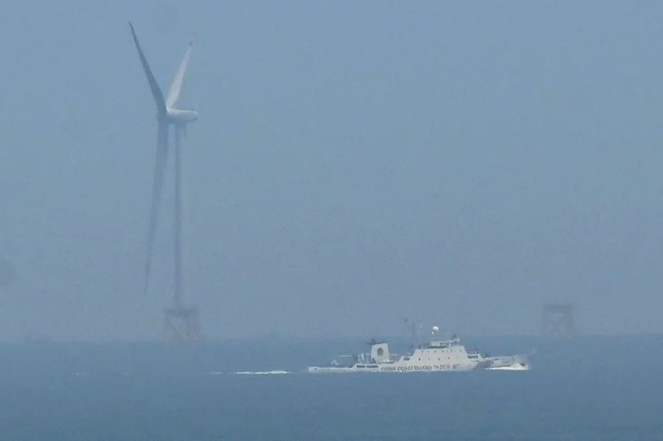 A China Coast Guard ship approaches the area where Beijing said it would conduct live firing exercises north-east of Pingtan island, the closest point in China to Taiwan, on Monday (Apr 10).  