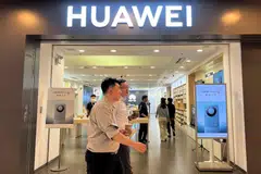 A Huawei store with advertisements for the Mate 60 series of smartphones in a mall in Beijing on Wednesday.  The launch was so low-key that staff at Huawei and sales personnel at stores in Beijing and Shenzhen said they were caught off-guard.