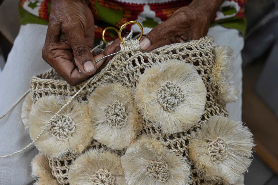 The boutique workshop in Port Moresby hosts a group of women who specialise in intricately lacing plant fibres together to make roomy pouches known as bilums, a symbol of indigenous pride.
