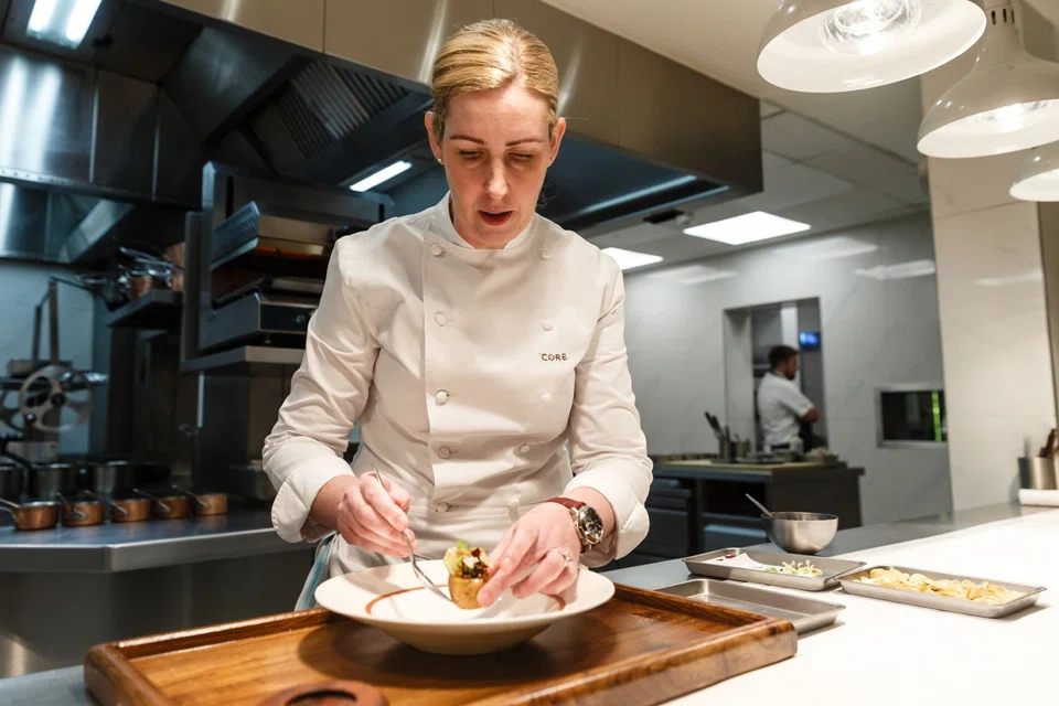 Chef Clare Smyth prepares a dish at the Core by Clare Smyth, a three-Michelin-starred restaurant in the Notting Hill district of London.