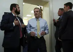 Jim Jordan (centre) - a Donald Trump loyalist heavily implicated in the former president’s efforts to overturn the 2020 presidential election - suffered humiliating defeats on the House floor in his first two bids for the gavel.