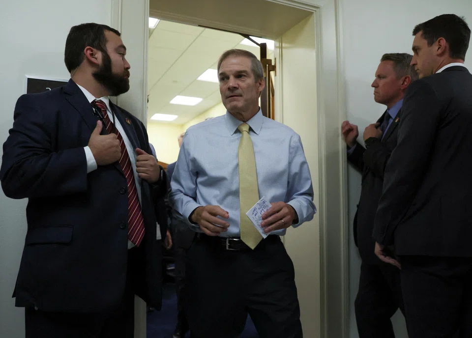 Jim Jordan (centre) - a Donald Trump loyalist heavily implicated in the former president’s efforts to overturn the 2020 presidential election - suffered humiliating defeats on the House floor in his first two bids for the gavel.