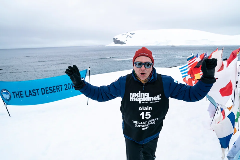 Alain Esseiva at the finish line of the Last Desert in Antarctica. 