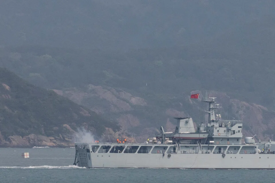 A Chinese warship fires towards the shore during a military drill near Fuzhou, Fujian Province, near the Taiwan-controlled Matsu Islands that are close to the Chinese coast, China, April 8, 2023.  