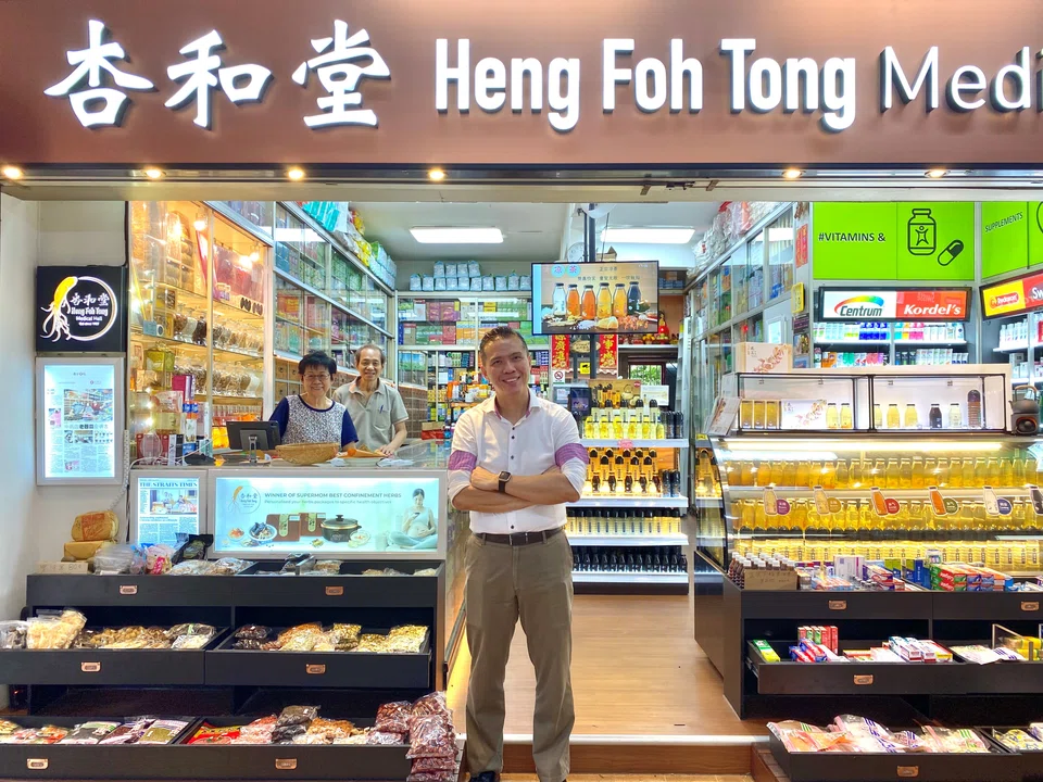 Lee Chin Siong (centre), vice-president of traditional Chinese medicine (TCM) hall Heng Foh Tong, with his father Lee Khee Lian and mother Chye Nyuk Lian. 