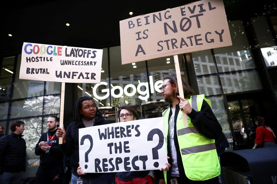 Google workers and others holding signs, including a reference to the company's "Don't be evil" code of conduct phrase, at a demonstration against alleged union busting and layoffs risk outside the Kings Cross headquarters in London.  More than 200,000 tech industry employees have been laid off this year, according to Layoffs.fyi.
