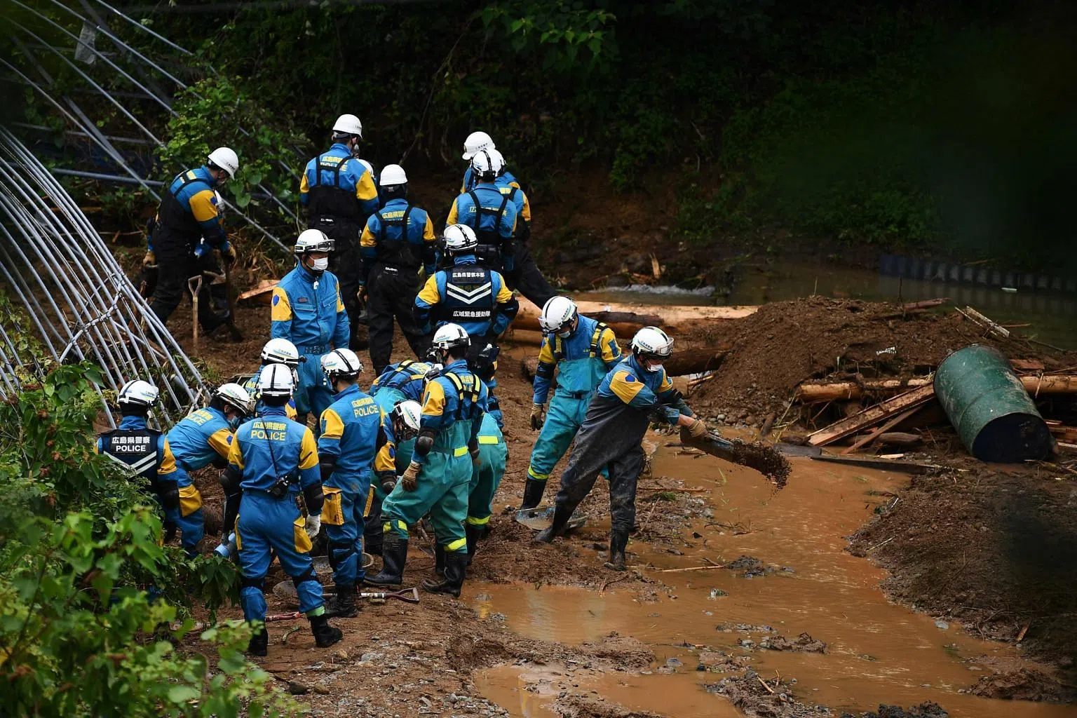 Japan rescuers battle to reach thousands trapped by floods - The ...