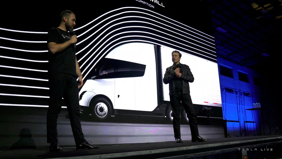 Tesla chief executive Elon Musk speaks with Dan Priestly, senior manager of Tesla Semi Truck Engineering, during the live-streamed unveiling of the Tesla Semi electric truck, in Nevada, U.S. Dec 1, 2022.